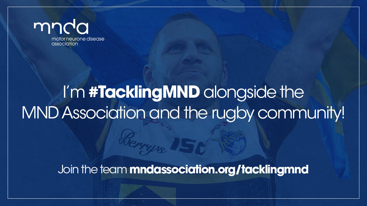 Rob Burrow holding flag with quote