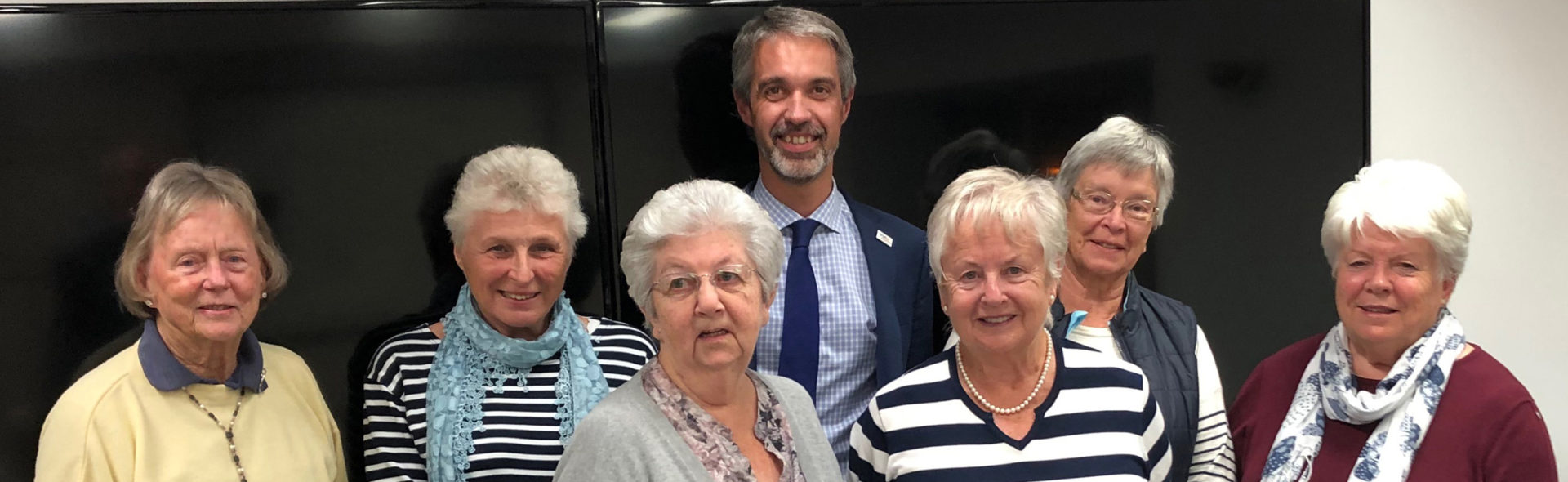 group of people smiling at the camera