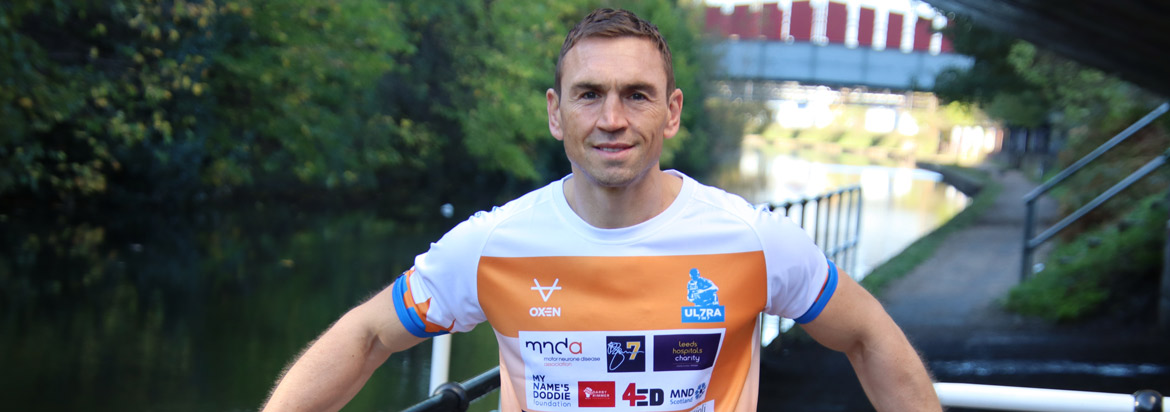 Kevin Sinfield stood by a river