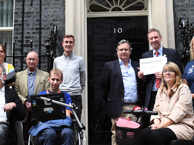 group of people outside number 10