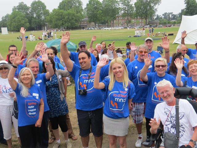 a group of people wearing mnd association t-shirts