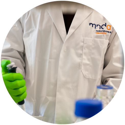 A person in an MND Association lab coat