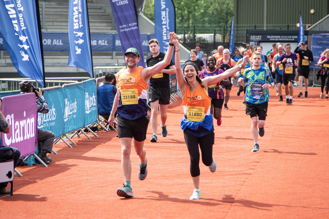Leeds Marathon - couple running towards the finish line