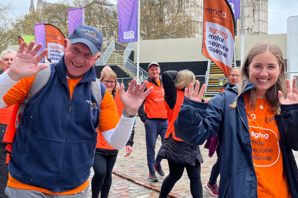 a group of people wearing mnd association t-shirts