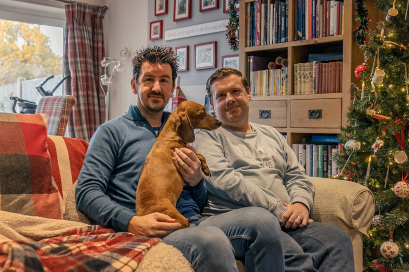 Sam and James holding dog