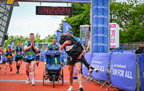 Kevin Sinfield carrying Rob Burrow over the finish line at the Leeds Marathon