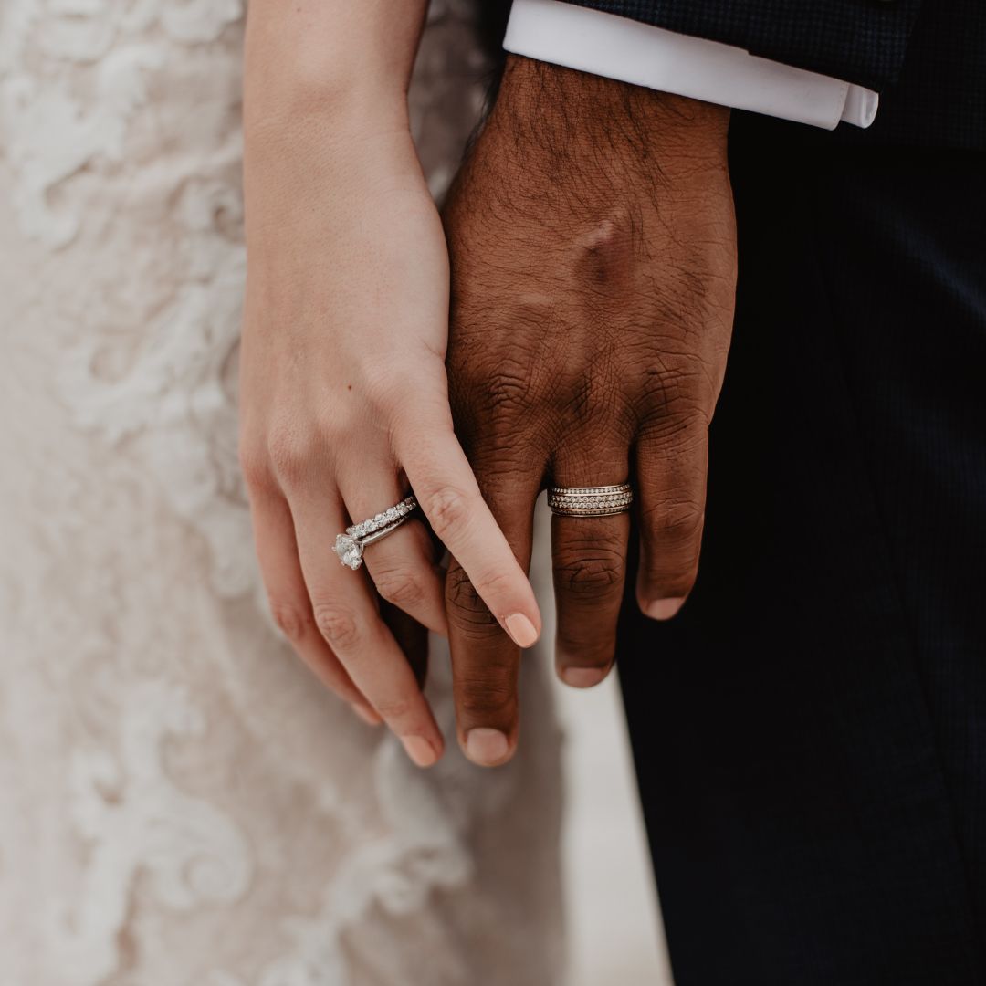 Husband and wife's hands entwined