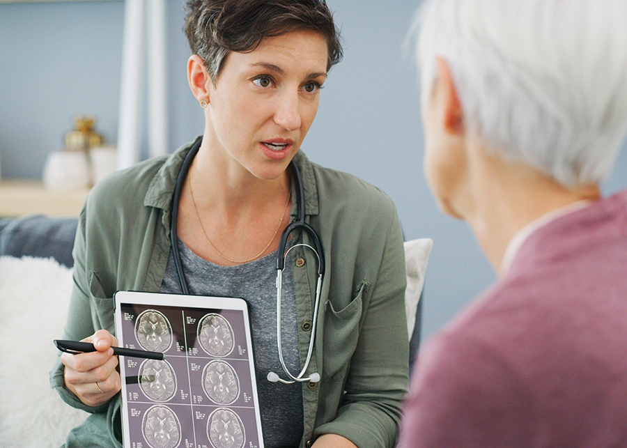 A doctor discussing a brain scan with a patient