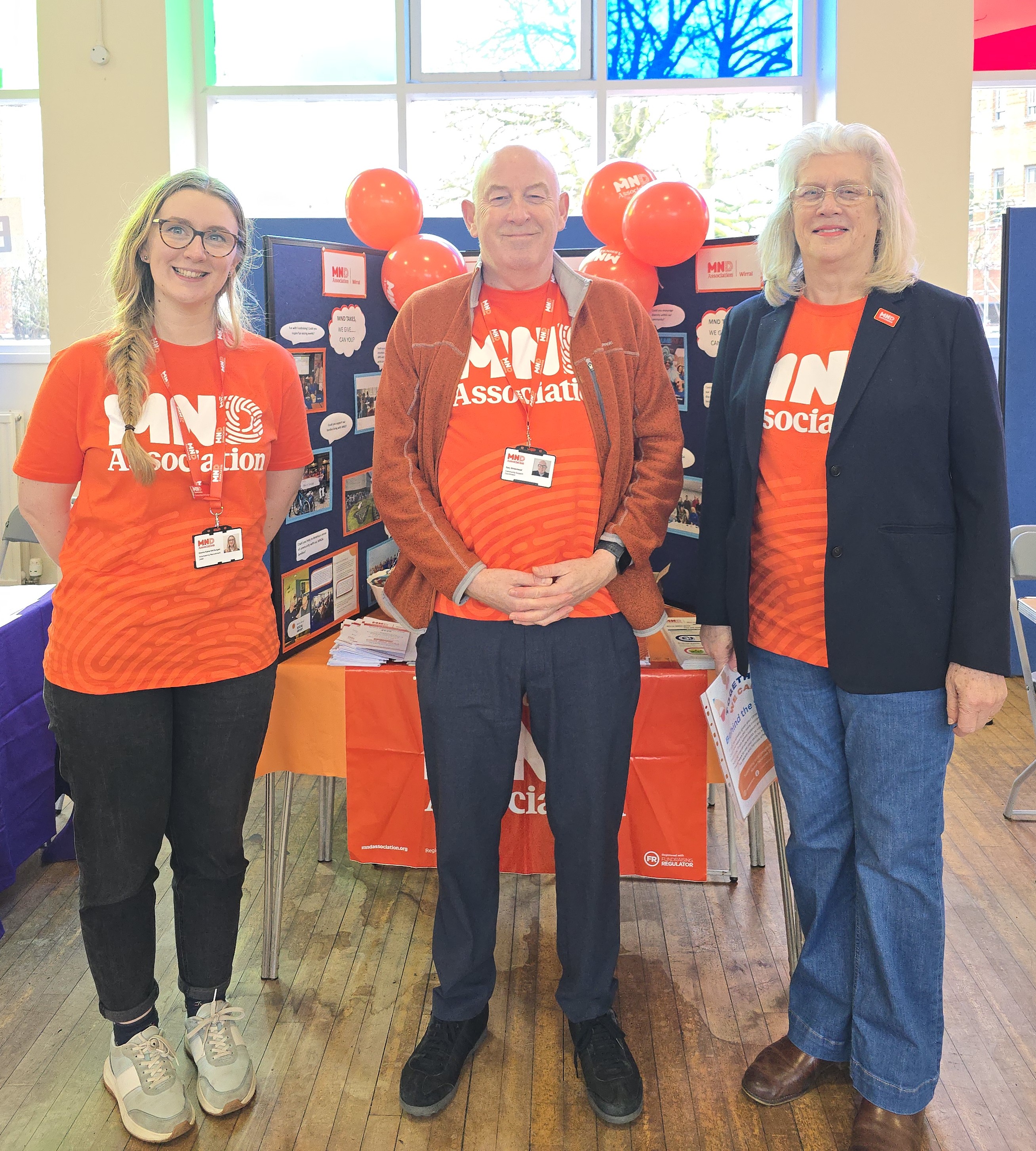Staff and Volunteers smiling at event