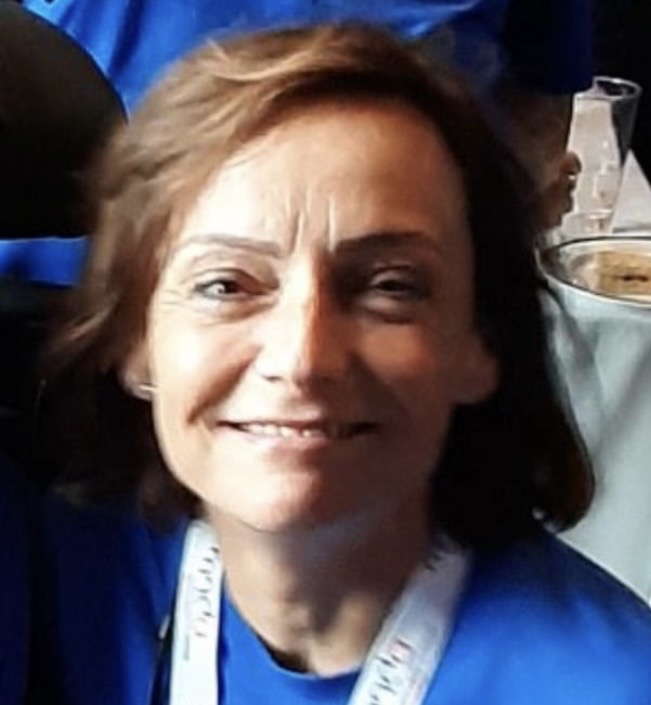 Volunteer smiling with lanyard