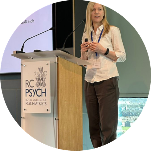 A photo of Prof Rebecca Gould presenting at a conference