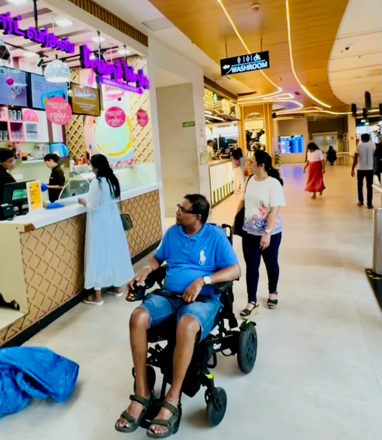 Jay and Sylvia exploring a shopping mall in India during their visit