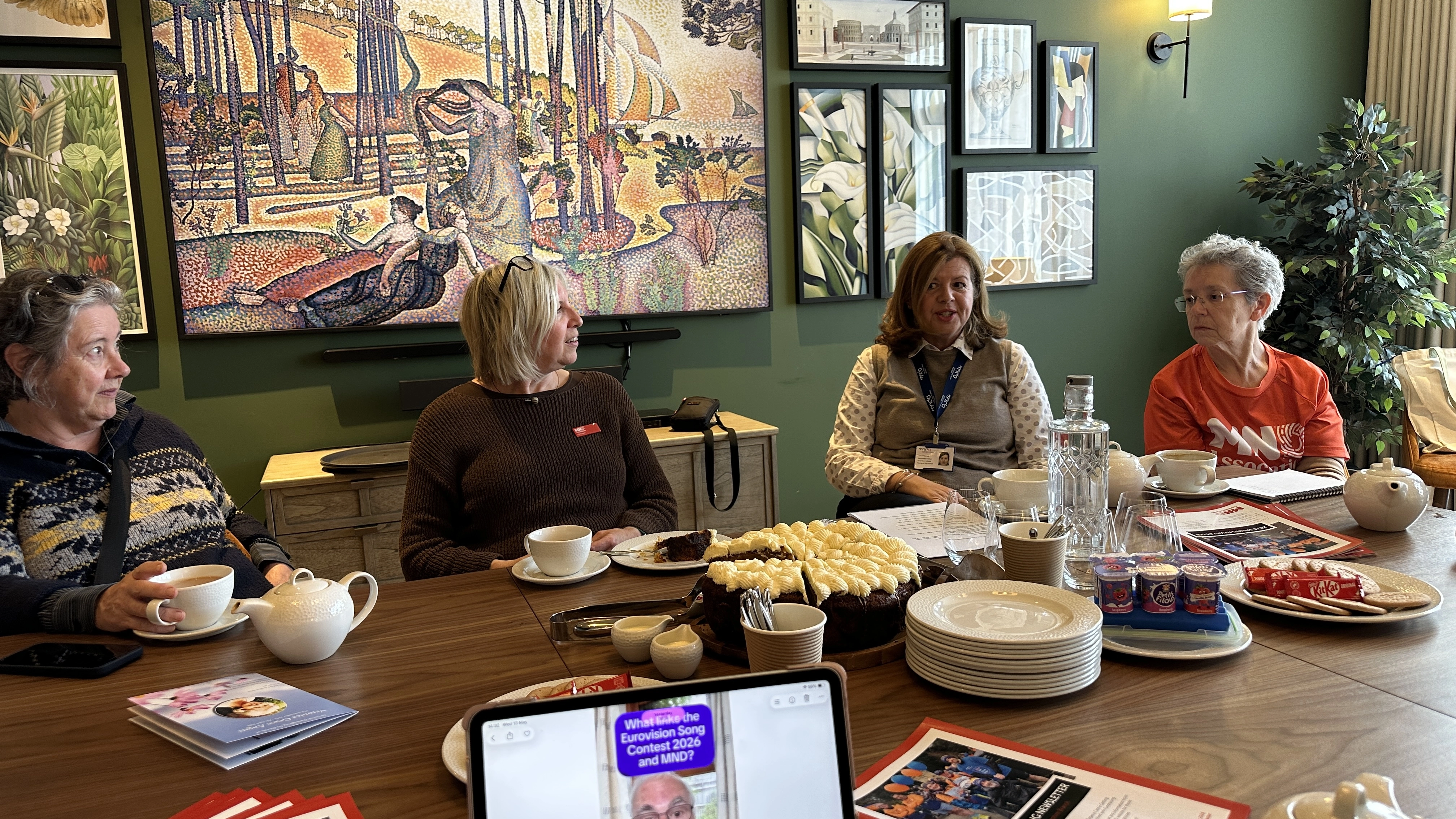 Volunteers at a meeting talking