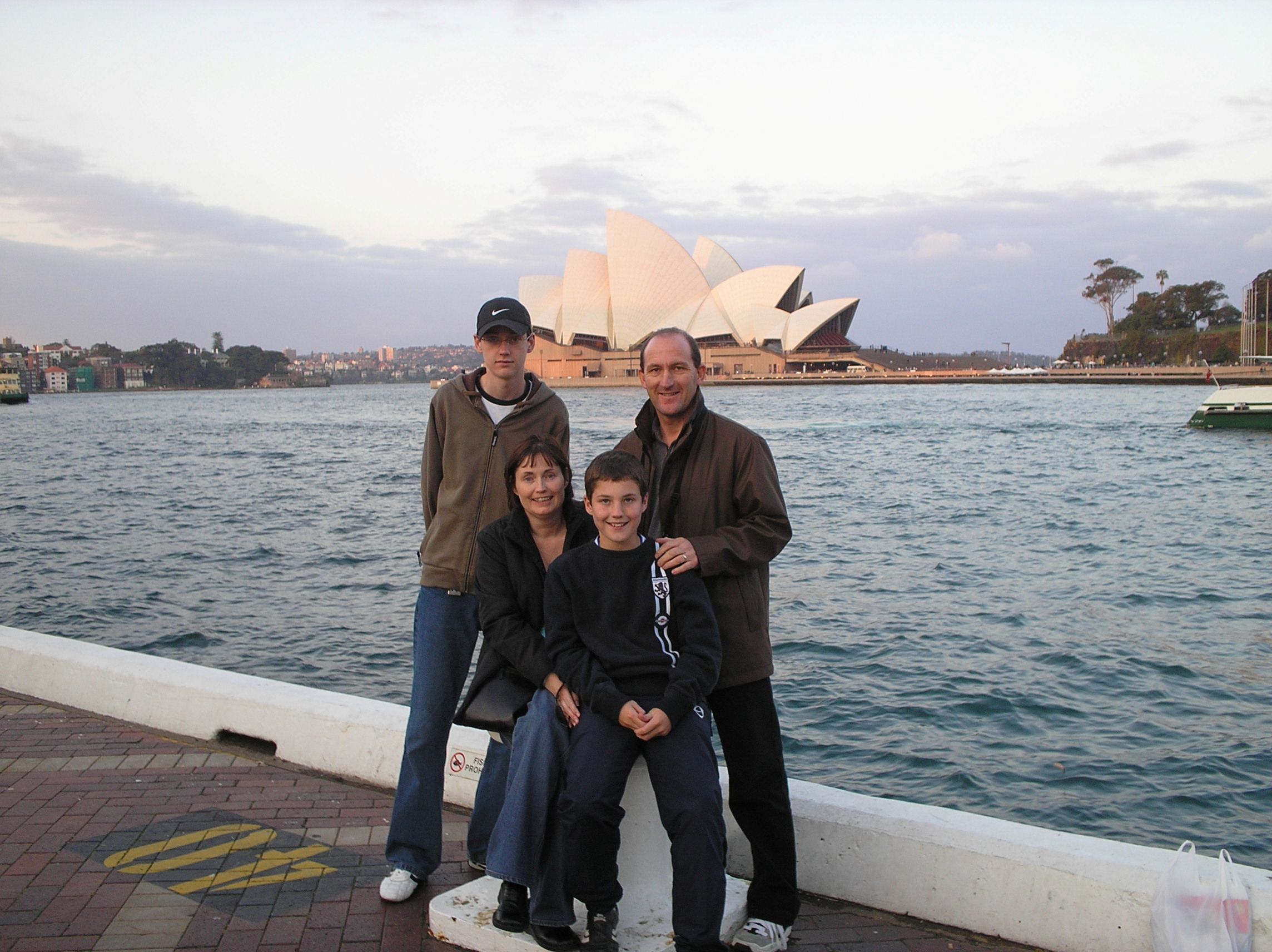 Chris, Brenda and their two sons outside the Sydney Opera House