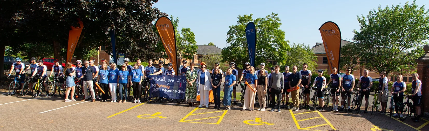 Toyota GB cyclists at MND Association head office as part of challenge