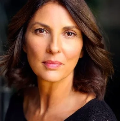 Gina Bellman looking at camera