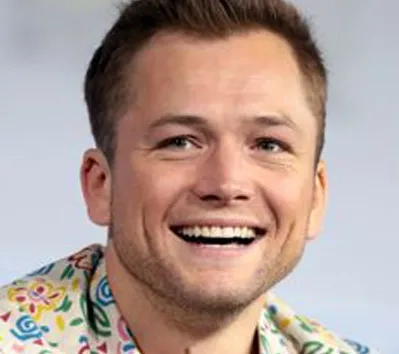 Taron Egerton smiling