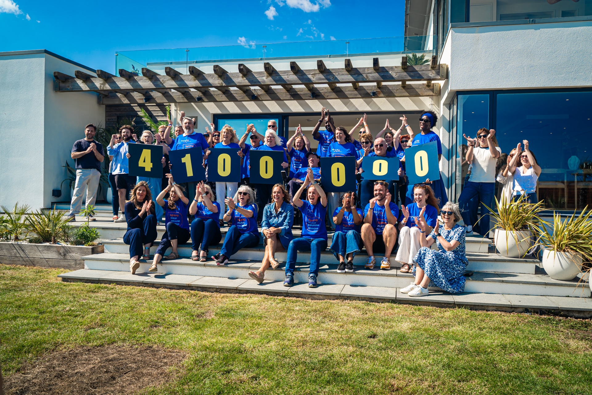 Team MND celebrate the amount raised through the Association's partnership with the Omaze Million Pound House Draw