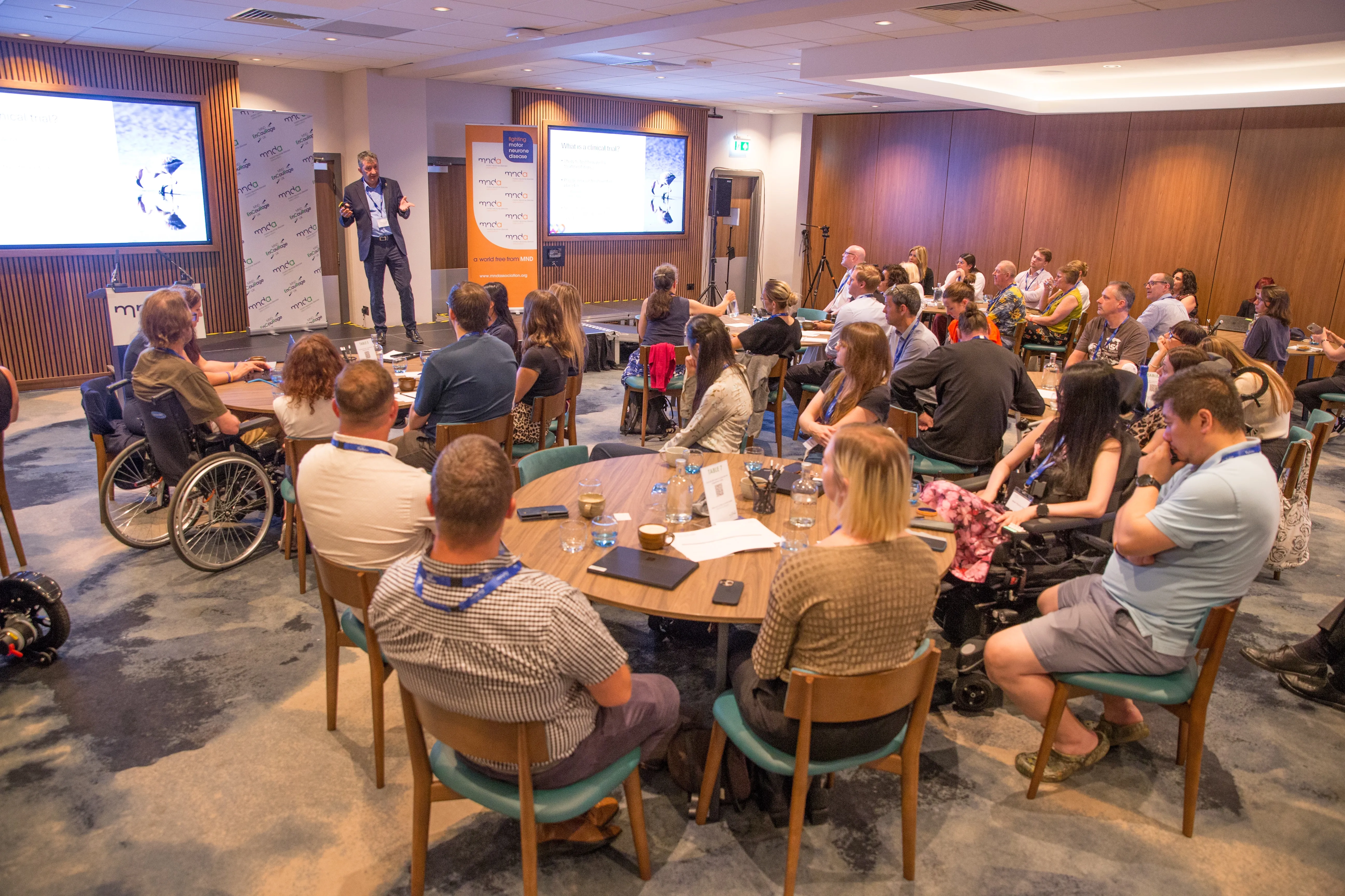 A full room of people listening to a talk at MND EnCouRage 2025.