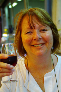 Diana enjoying a glass of red wine