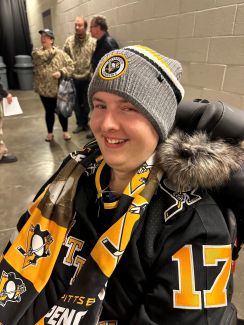 Rob in his Pittsburgh Penguins merch at a game