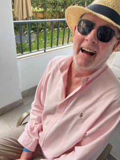 Adrian smiling on holiday