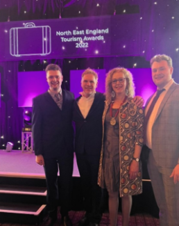 Martin, wife Rachel and sons Jacob and Nathan at awards for escape room