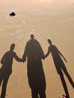 James and his sons at the beach - shadows