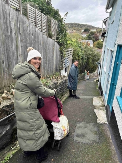 James with his wife Carly and their children walking outside