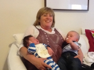 Sarah's mum with two grandchildren.