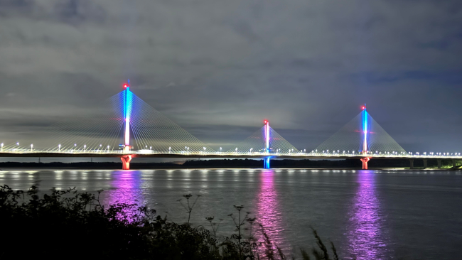 The Mersey Gateway lit up in Association colours