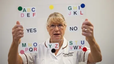 Speech and language therapist using an eye transfer frame