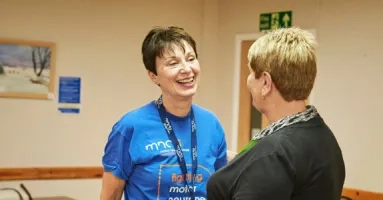 Two volunteers talking