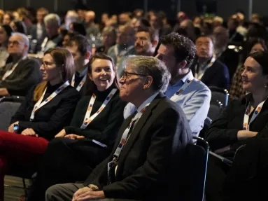 An audience sitting in an auditorium.