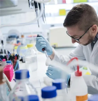A researcher using a pipette