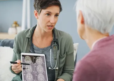 A doctor discussing a brain scan with a patient