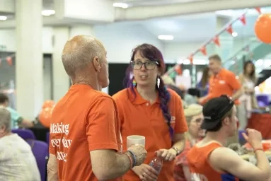 Volunteers having a conversation at an event