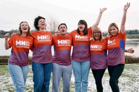 A group of people celebrating the fundraise event