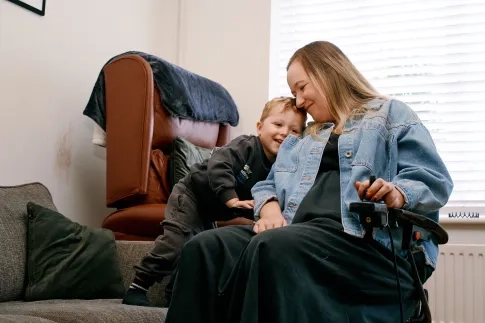 Charlotte Cooke at her home with her son