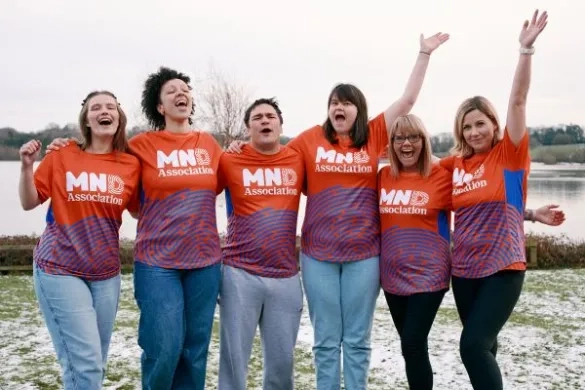 A group of people celebrating in a team