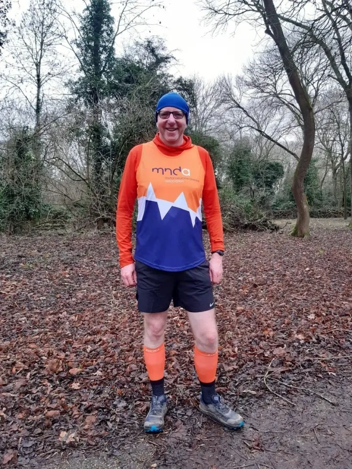 Grant stood with his MND Association branded running gear.