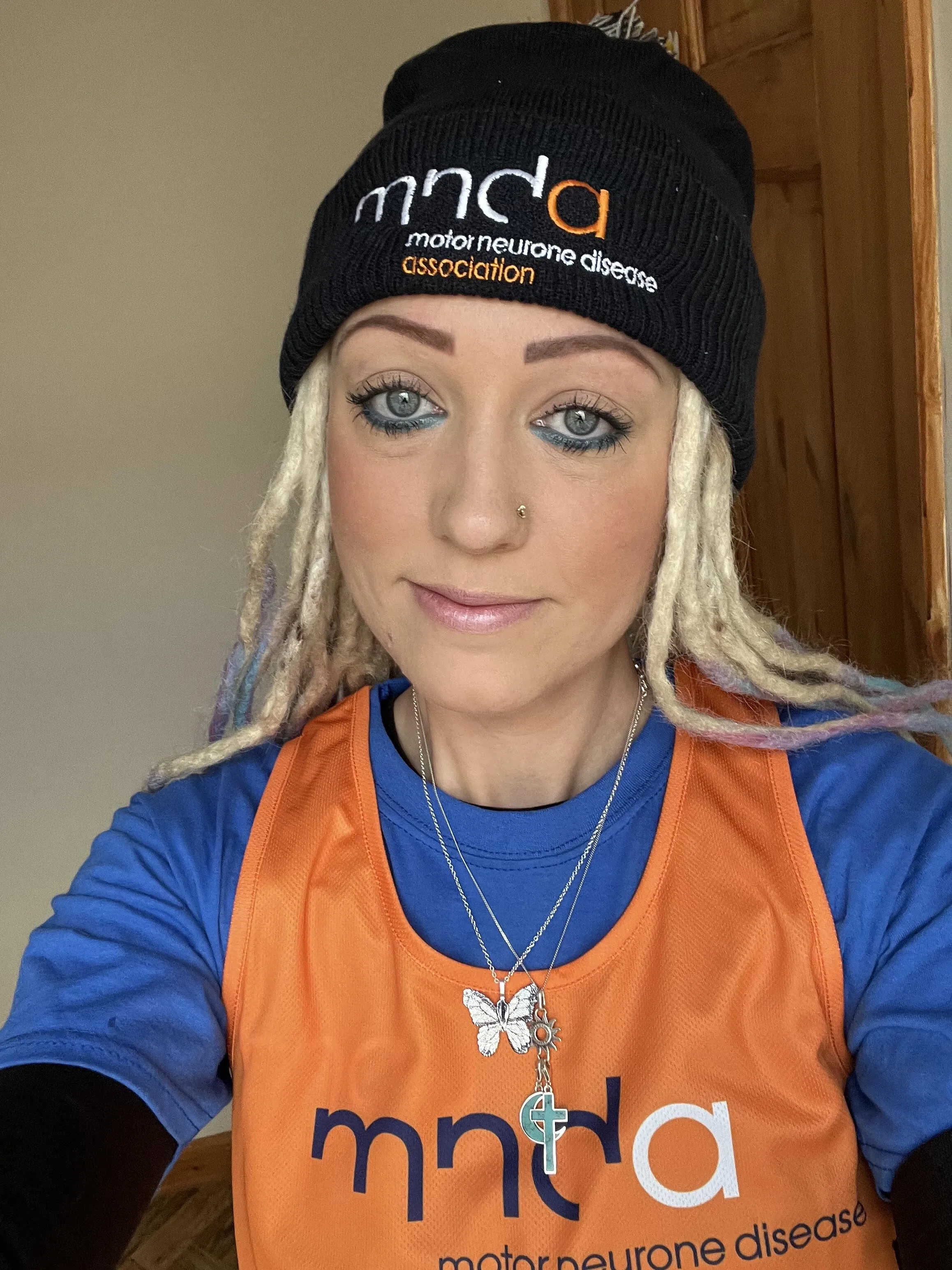 Rosie in her MND hat and running vest