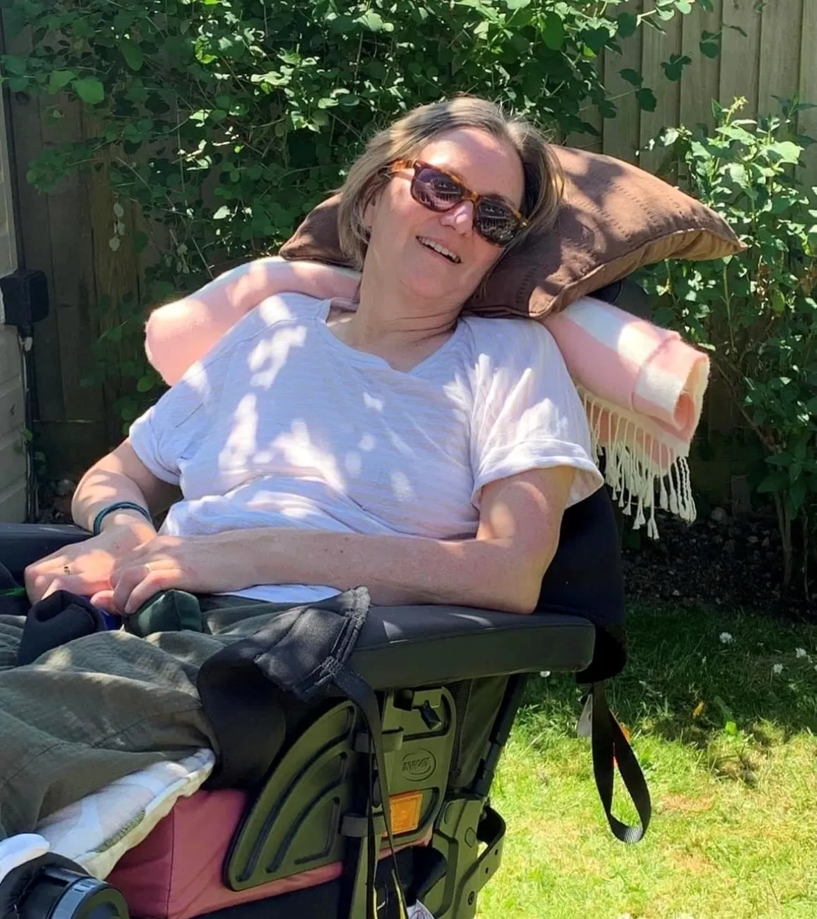 Norma in her chair in the garden
