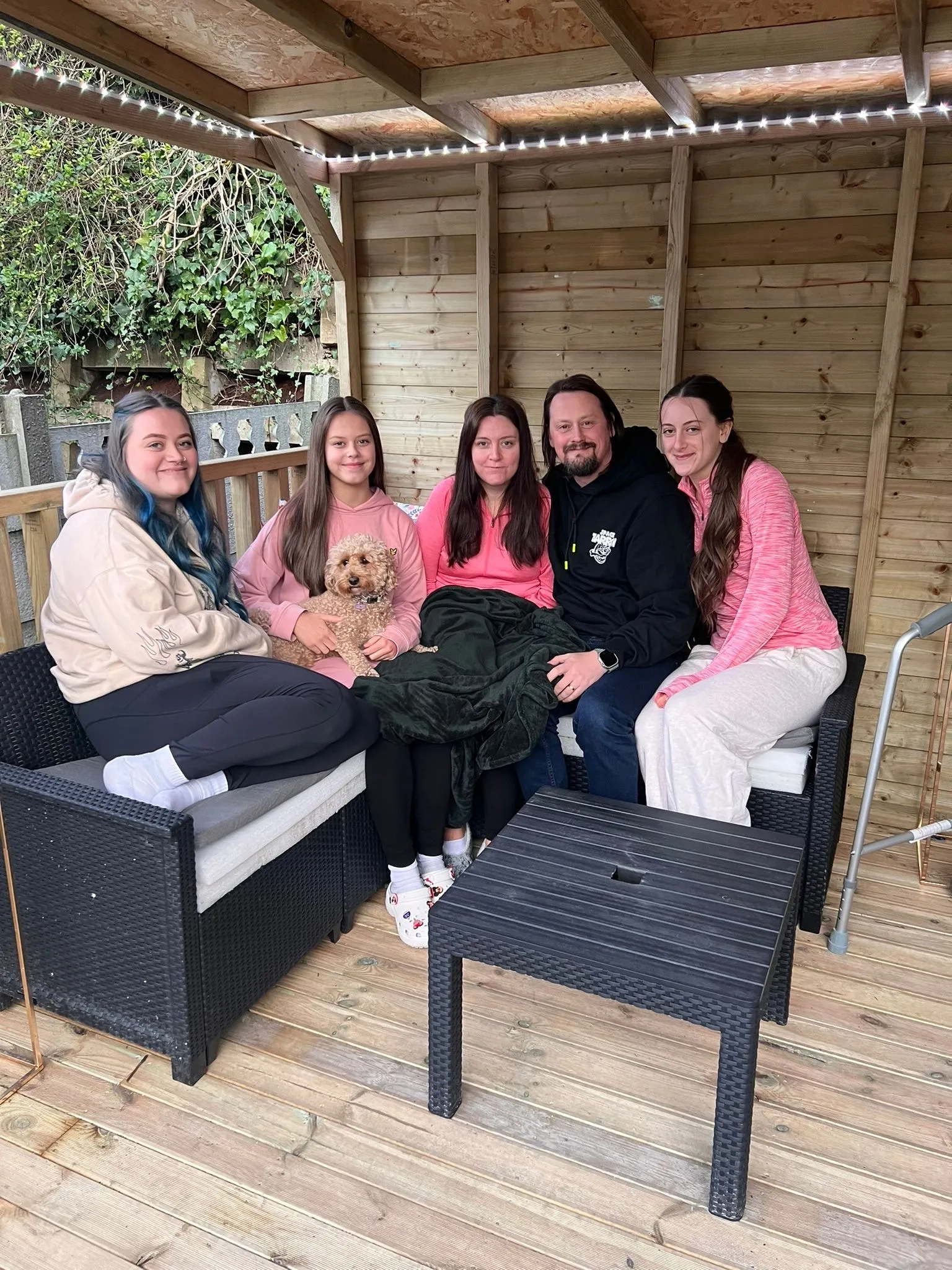 Martyn and Anna Barrow with their daughters in the garden