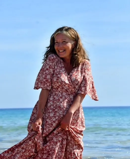 Debbie on a beach before MND