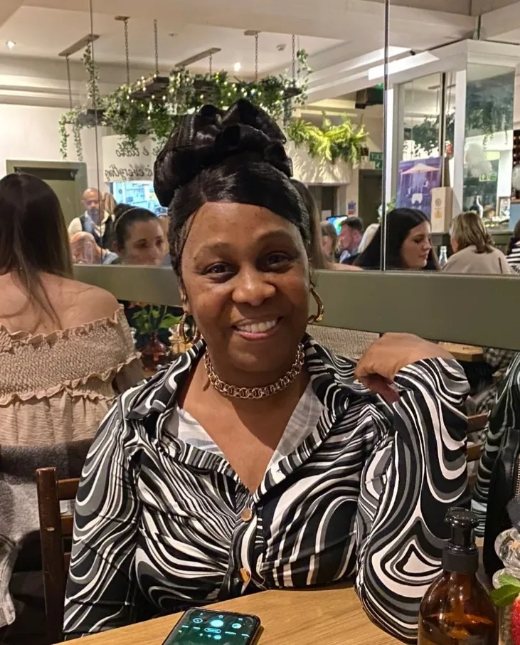 Lorraine smiling at camera