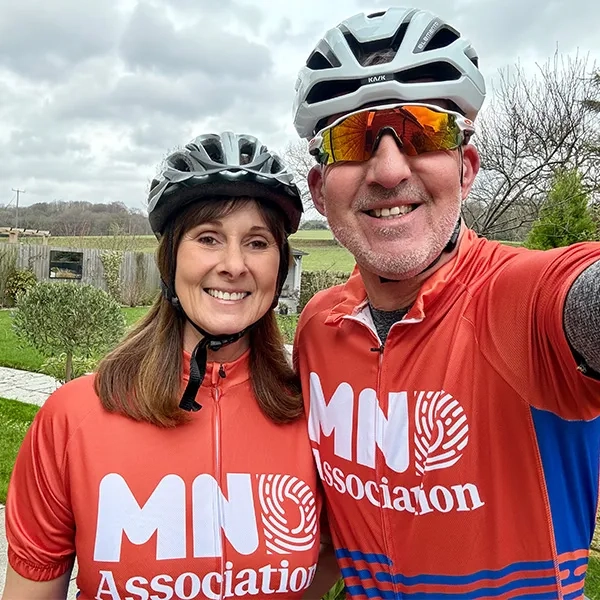 people wearing mnd association cycle jersey