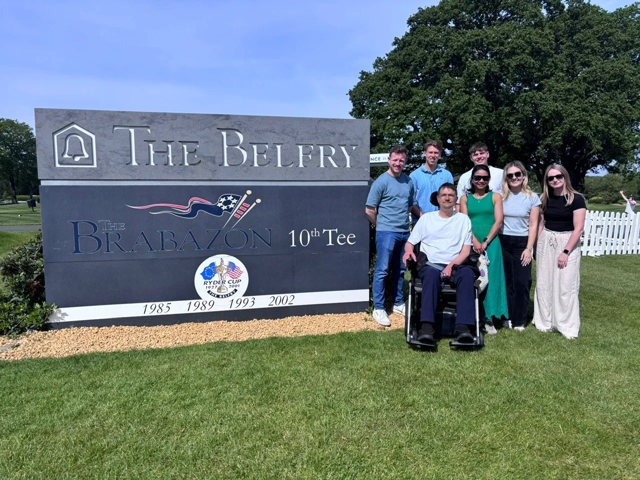 Team outside the Belfry sign 2026