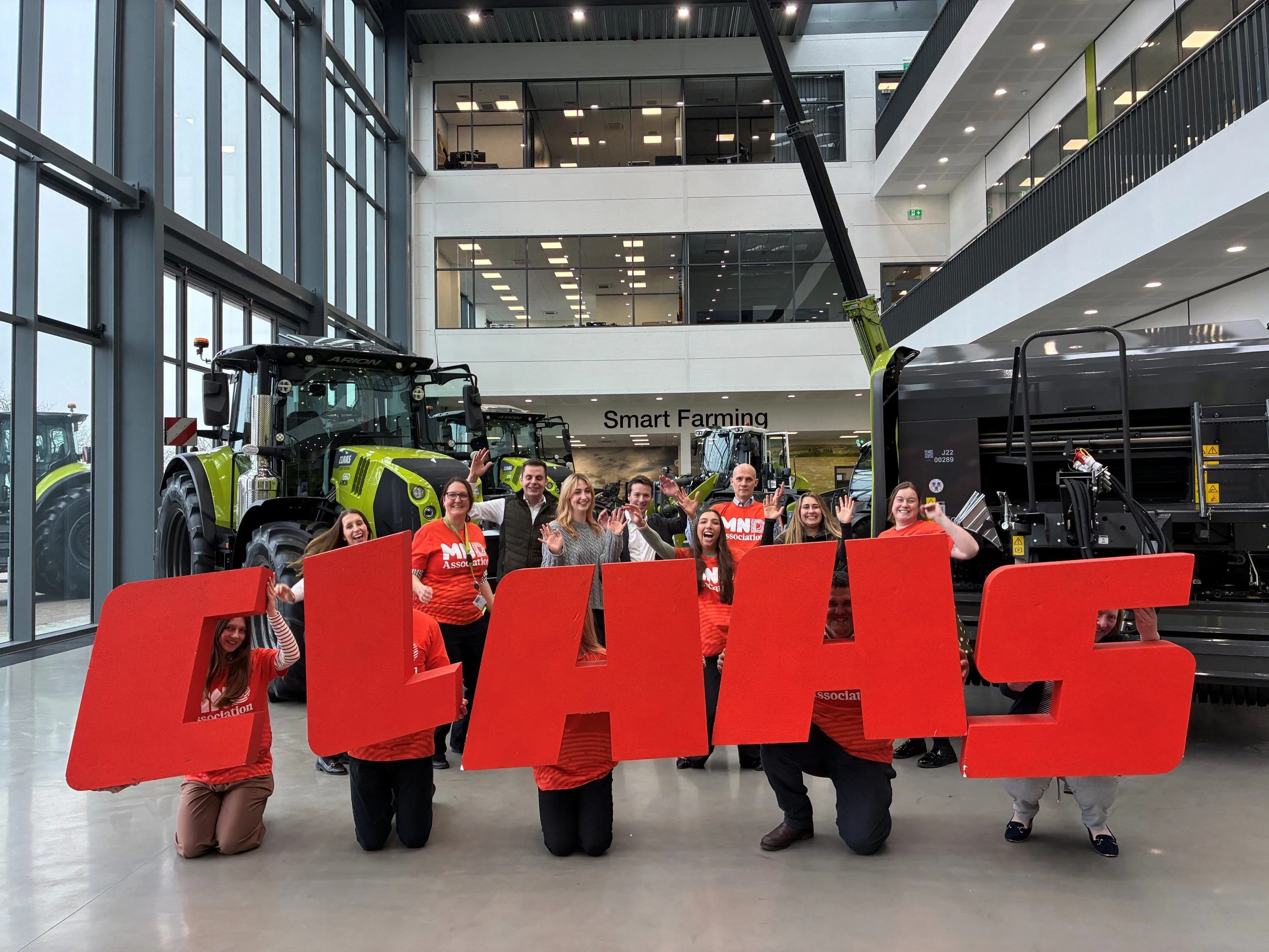 CLAAS launch image holding letters fun