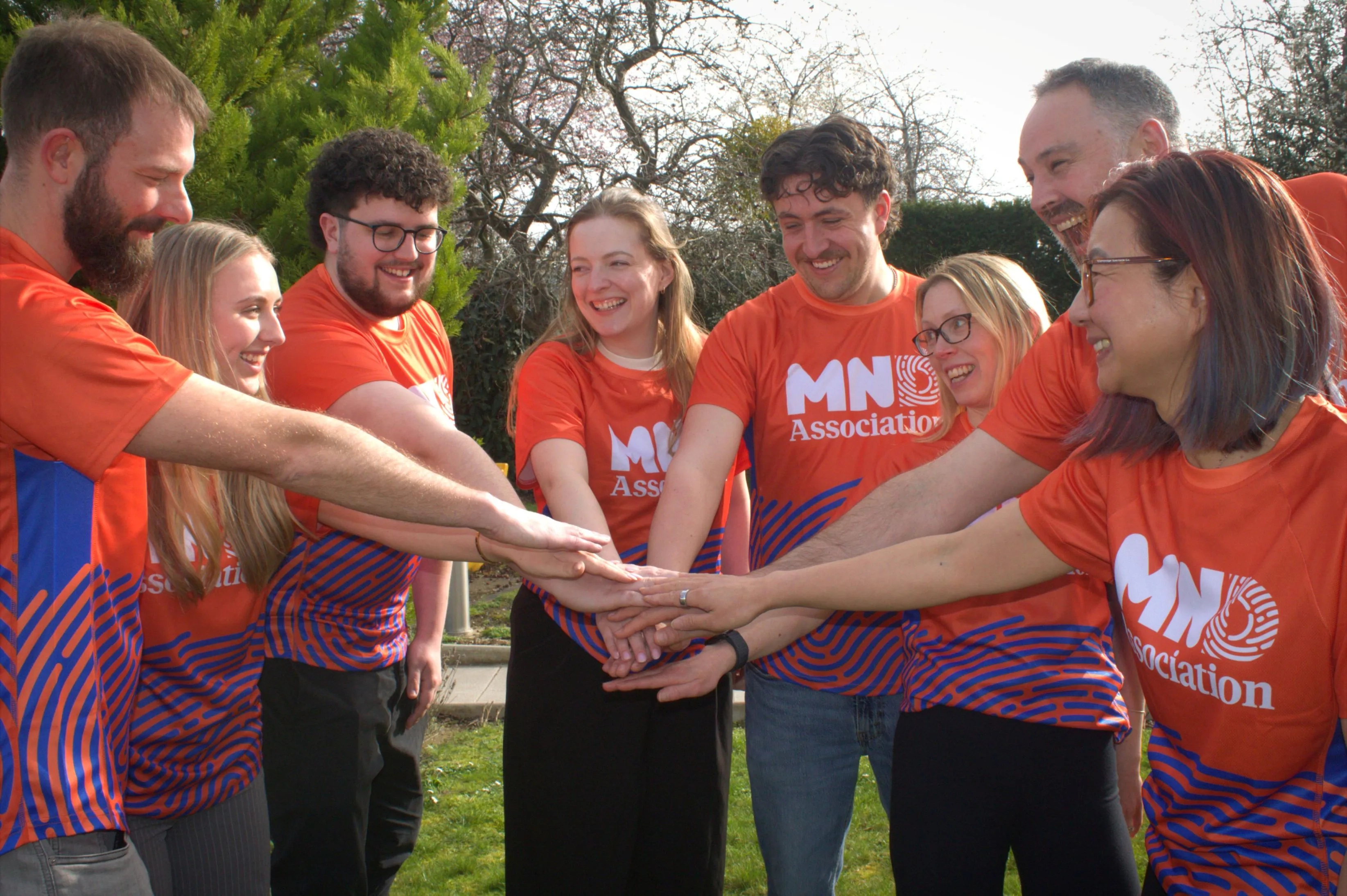Kohler Mira team members joining hands at launch